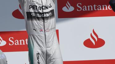 Le pilote britannique de Mercedes Lewis Hamilton célebrant sa 1r place au terme du GP de Grande-Bretagne à Silverstone le 6 juillet 2014. [Dimitar Dilkoff / AFP]