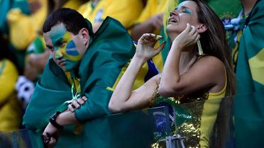 Des supporters brésiliens  lors de la finale Brésil Allemagne le 8 juillet 2014 à Belo Horizonte  [Adrian Dennis / AFP]