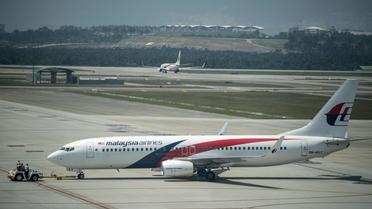 Un avion de la Malaysia Airlines le 21 juillet 2014 sur le tarmac de l'aéroport de Sepang à Kuala Lumpur  [Mohd Rasfan / AFP]