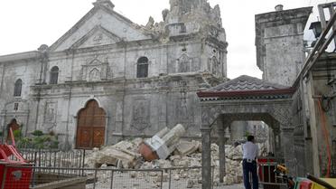 La Basilique de Cebu en partie détruite par un violent séisme, le 15 octobre 2013 aux Philippines [Jay Directo / AFP]