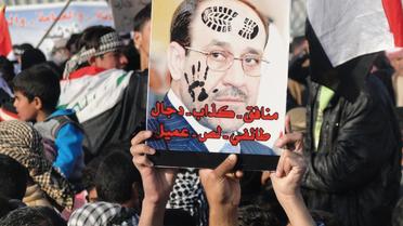 Des Irakiens sunnites qualifient le Premier ministre sortant Nouri al-Maliki de "menteur... sectaire, voleur, collaborateur", à Ramadi, en janvier 2012 [Azhar Shallal / AFP/Archives]
