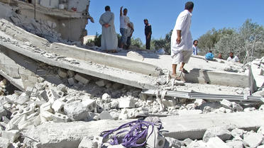 Un bâtiment détruit après un bombardement des forces gouvernementales syriennes dans la province d'Idleb, tenue par les rebelles, le 5 septembre 2013 [- / Abu Amar Al-Taftanaz/AFP]