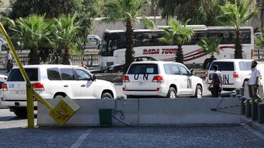 Des véhicules des experts en armes chimiques de l'ONU, le 26 septembre 2013 à Damas [Louai Beshara / AFP/Archives]