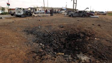 Les dégats causés par l'explosion d'une voiture piéger à l'académie militaire de Benghazi le 17 mars 2014 [Abdullah Doma / AFP/Archives]