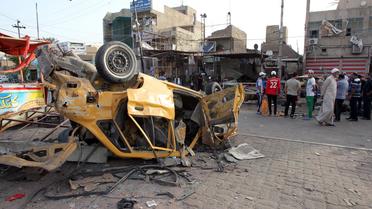 Rue de Sadr City le 29 mai 2014, frappée par une explosion la veille [Ali Al-Saadi / AFP]
