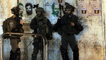 Des gardes-frontières israéliens participent à l'opération de recherche des trois jeunes disparus en Cisjordanie, le 22 juin 2014 à Ramallah  [Abbas Momani / AFP]