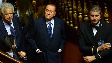 Silvio Berlusconi arrive au Sénat italien où doit se tenir un vote de confiance pour le gouvernement d'Enrico Letta, le 2 octobre 2013