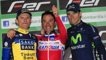 L'Espagnol Joaquin Rodriguez, vainsueur du Tour de Lombardie et entouré du 2e, son compatriote Valverde et du 3e, le Polonais Majka, le 6 octobre 2013 à Lecco (Italie) [LUK BENIES / AFP Photo]
