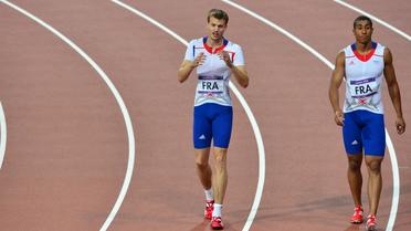 Christophe Lemaitre et Jimmy Vicaut après la finale du relais 4X100 m lors des Jeux Olympiques de Londres le 11 Août 2012 [Gabriel Bouys / AFP/Archives]