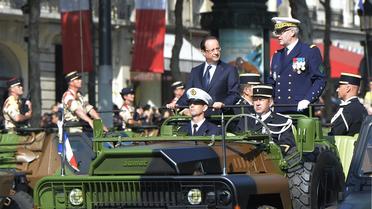 Le président François Hollande, lors du défilé aux Champs-Elysées, le 14 juillet 2013 [Miguel Medina / AFP]