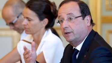 François Hollande (d) en réunion le 1er août 2013 à Paris [Christian Hartmann / Pool/AFP]