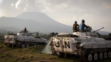 Des casques bleus de la Mission des Nations unies au Congo (Monusco) assis sur des tanks, le 13 août 2012 à Kibati, à 10 km de Goma [Michele Sibiloni / AFP/Archives]