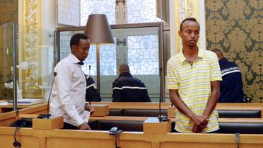 Deux des trois pirates arrêtés sur la Tanit en avril 2009, dans le box des accusés, le 14 octobre 2013, à Rennes, devant la cour d'assises d'Ille-et-Vilaine [Damien Meyer / AFP]