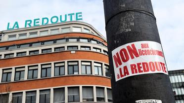 Après avoir annoncé une vague de licenciements, le leader de la vente par correspondance La Redoute espère "sortir du rouge" en 2017 [Philippe Huguen / AFP/Archives]