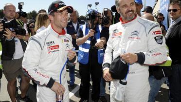 Les pilotes français Yvan Muller (d) (Citroën) et Sébastien Loeb (Citroën) lors du Championnat du monde des voitures de tourisme, le 19 avril 2014 au Castellet [Franck Pennant / AFP]