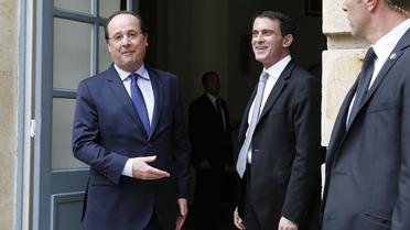 François Hollande et Manuel Valle le 28 avril 2014 à la Maison de la chimie à Paris  [Yoan Valat / Pool/AFP]