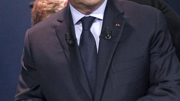 Le président François Hollande dans les studios de BFM TV et RMC le 6 mai 2014, juste avant sa visite à Villiers le Bel où il a promis une réforme du permis de conduire [Thibautlt Camus / AFP]