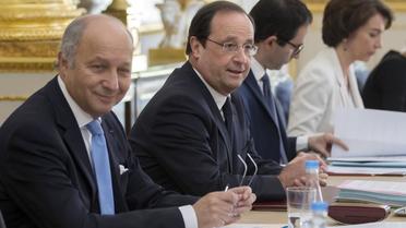 Laurent Fabius et Francois Hollande lors du Conseil des ministres le 18 juin 2014 à l'Elysée à Paris   [Ian Langsdon  / Pool/AFP]
