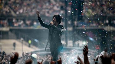 Le chanteur d'Indochine Nicola Sirkis en concert le 27 juin 2014 au Stade de France [Stéphane de Sakutin / AFP]