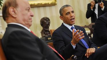 Barack Obama (d) parle lors d'une rencontre avec le président yéménite Abd Rabbo Mansour Hadi (g), le 1er août 2013 à la Maison blanche, à Washington [Mandel Ngan / AFP]