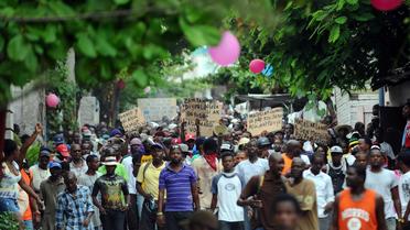 Des milliers de manifestants à Port-au-Prince le 5 juin 2014 exigent la tenue d'élections et la démission du président Michel Martelly [Hector Retamal / AFP]