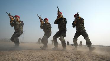Des hommes s'entraînent à la Genghis Security Academy près de Pékin, le 18 janvier 2013 [Ed Jones / AFP]