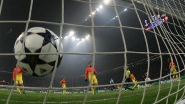 Le FC Barcelone encaisse un but lors du match de Ligue des champions contre l'AC Milan, le 20 février 2013 à Milan [Alberto Lingria / AFP/Archives]
