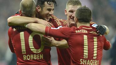 La joie des joueurs du Bayern après l'un de leurs 9 buts contre Hambourg, le 30 mars 2013 à Munich [Christof Stache / AFP]