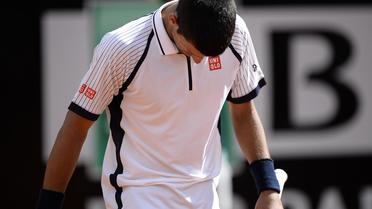Le Serbe et N.1 mondial Novak Djokovic après sa défaite en quart de finale du Masters 1000 de Rome contre le Tchèque Tomas Berdych, le 17 mai 2013 [Filippo Monteforte / AFP]