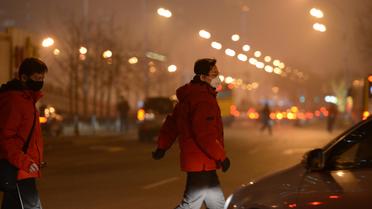 Des piétons à Pékin, le 30 janvier 2013 [Mark Ralston / AFP/Archives]