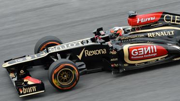 Kimi Räikkönen à bord de sa Lotus-Renault lors de la 2e séance d'essais libres du Grand Prix de Malaisie, le 22 mars 2013 à Sepang [Roslan Rahman / AFP]