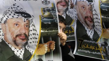 Des portraits de l'ancien dirigeant palestinien Yasser Arafat, le 11 novembre 2012 à Naplouse [Jaafar Ashtiyeh / AFP/Archives]