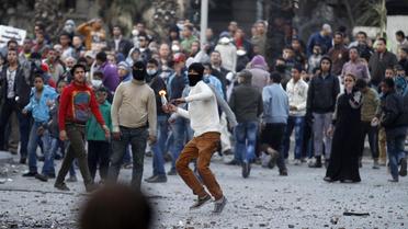 Heurts entre manifestants égyptiens et police, le 30 janvier 2013 près de la place Tahrir, au Caire [Mohammed Abed / AFP]