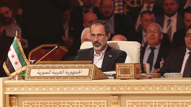 Le chef démissionnaire de la Coalition nationale syrienne, Ahmad Moaz Al-Khatib, au sommet de la Ligue arabe à Doha le 26 mars 2013 [ / AFP]