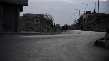 Des personnes dans une rue d'Alep le 28 mars 2013 [Bulent Kilic / AFP]