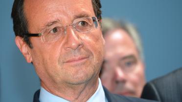 François Hollande a déclaré vendredi à Evian (Haute-Savoie) avoir "pris des engagements" pendant la campagne et que ceux-ci seraient "tenus", à propos de l'emblématique taxe à 75% sur les plus hauts revenus, sur laquelle il est soupçonné de vouloir faire machine arrière. [AFP]