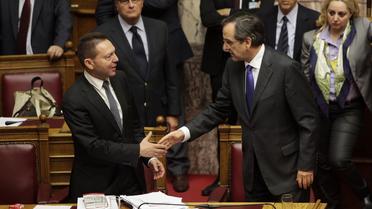 Le ministre grec des Finances Yannis Stournaras et le Premier ministre Antonis Samaras, au parlement à Athènes le 7 novembre 2012 [Panayiotis Tzamaros / AFP]