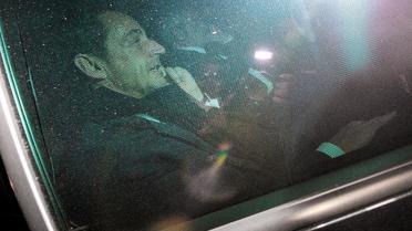 L'ancien président Nicolas Sarkozy quitte en voiture le palais de justice de Bordeaux le 22 novembre 2012 [Pierre Andrieu / AFP]