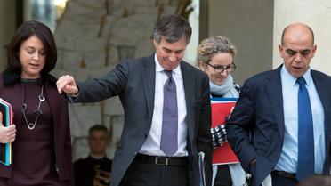 Jérôme Cahuzac entre Sylvia Pinel, Delphine Batho et Kader Arif le 9 janvier 2013 à la sortie du Conseil des ministres à l'Elysée [Bertrand Langlois / AFP]