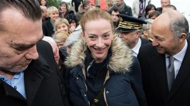 Florence Cassez  à son arrivée à Paris, le 24 janvier 2013, aux côté de Laurent Fabius et de son avocat Franck Berton