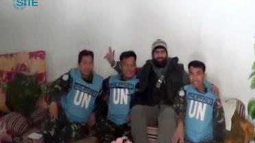 Certains des observateurs de l'ONU enlevés par des rebelles syriens, le 8 mars 2013 [ / SITE Intelligence Group/AFP]