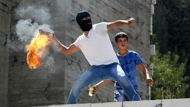 Un Palestinien lors de heurts avec les forces de sécurité israéliennes le 18 septembre 2015 à Hébron  [HAZEM BADER / AFP/Archives]