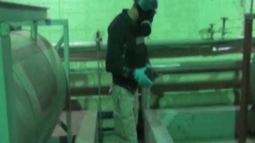 Capture d'une vidéo de la télévision syrienne montrant un inspecteur de l'OIAC en Syrie, le 8 octobre 2013 [ / Télévision syrienne/AFP/Archives]