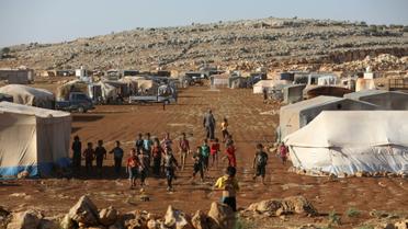 Des enfants se rassemblent dans un camp pour les déplacés à Kafr Dariyan, dans la province syrienne d'Idleb, le 26 août 2018  [OMAR HAJ KADOUR / AFP/Archives]