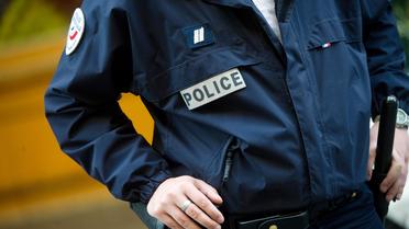 Un policier en uniforme [Bertrand Langlois / AFP/Archives]