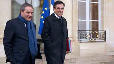 Xavier Bertrand (g) et Francois Fillon à leur sortie de l'Elysée, le 25 avril 2012 à Paris [Lionel Bonaventure / AFP/Archives]