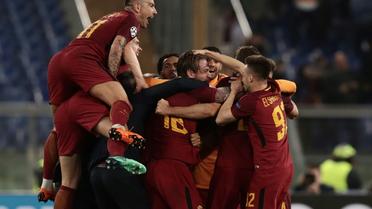 Les joueurs de l'AS Rome fous de joie après avoir renversé et éliminé le FC Barcelone en quart de finale retour de Ligue des champions le 10 avril 2018 [Isabella BONOTTO / AFP]