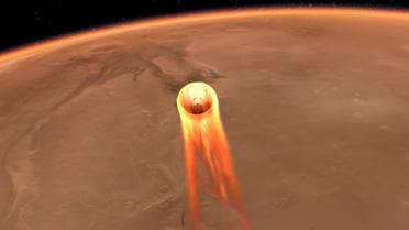 Illustration artistique fournie par la Nasa le 23 novembre 2018 montrant la descente de la sonde InSight vers la planète Mars [HO / NASA/JPL-CALTECH/AFP/Archives]
