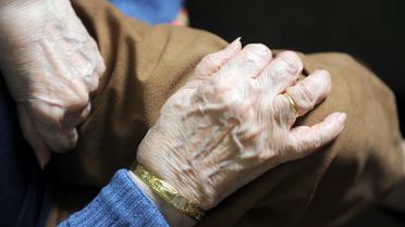 Les mains d'une femme âgée [Eric Cabanis / AFP/Archives]