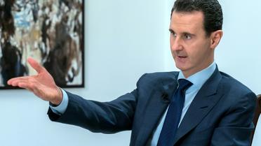 Photo transmise par l'agence officielle syrienne Sana du président Bachar al-Assad lors d'une interview, le 10 juin 2018 à Damas [Handout / SANA/AFP]